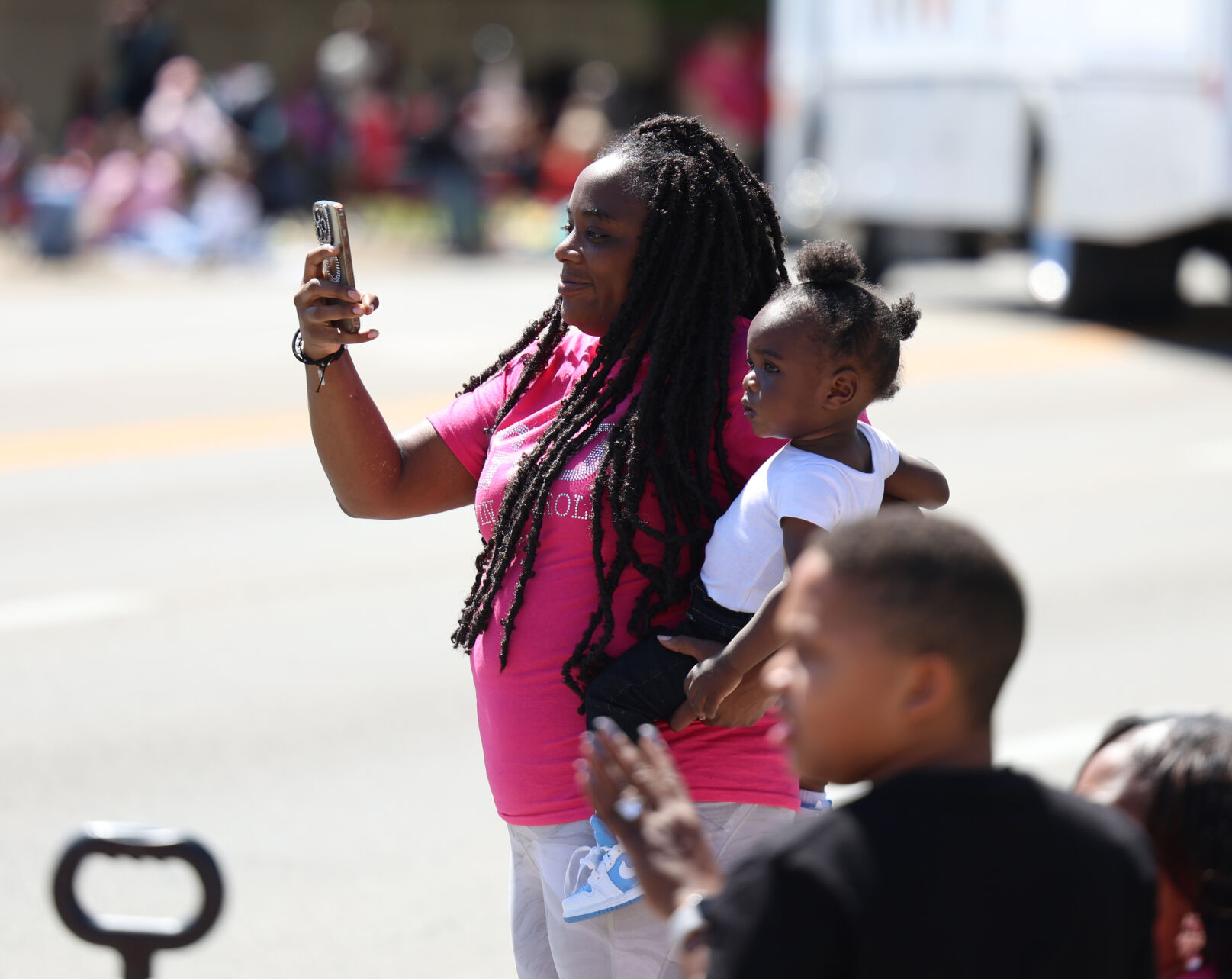 Woman takes selfie at Pegasus Parade.JPG